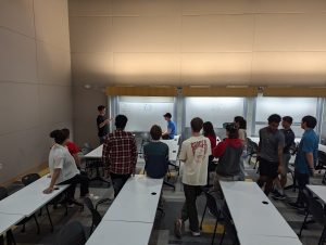 Build Team Members gathered around a whiteboard