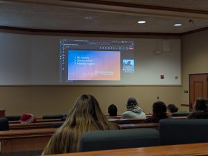 Lecture hall watching presentation given by a Walt Disney Imagineer