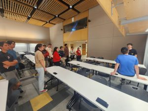 Build Team Members gathered around a whiteboard