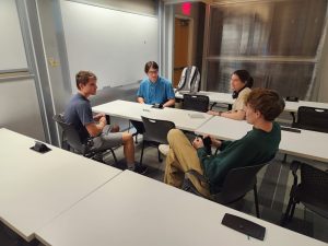 Build Team Members discussing ideas during meeting